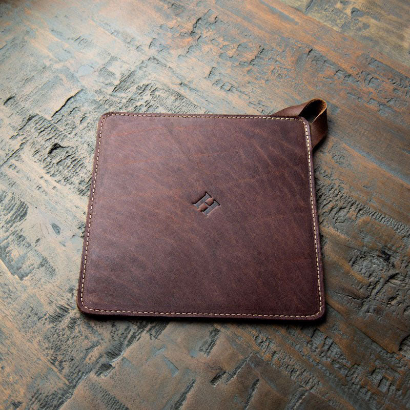 Leather trivet in brown, American made, perfect for protecting surfaces from hot pots.