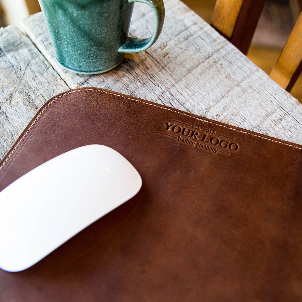 Leather mousepad with custom logo, perfect for office accessories and corporate gifting.
