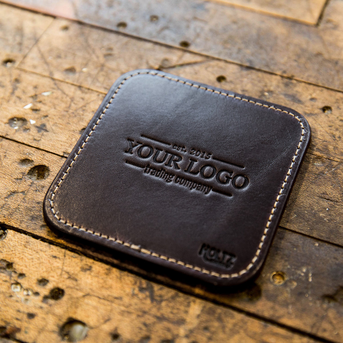 Leather coaster featuring custom logo, perfect for corporate gifting. Set of 4, American made.
