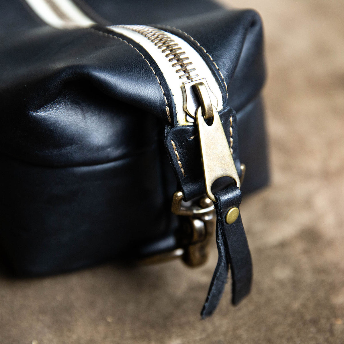 Dopp Bag - Personalized brown leather toiletry bag with zipper, perfect for travel and grooming essentials.