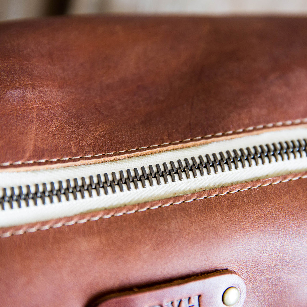 Dopp Bag - Personalized brown leather toiletry bag with zipper, ideal for travel and grooming essentials.
