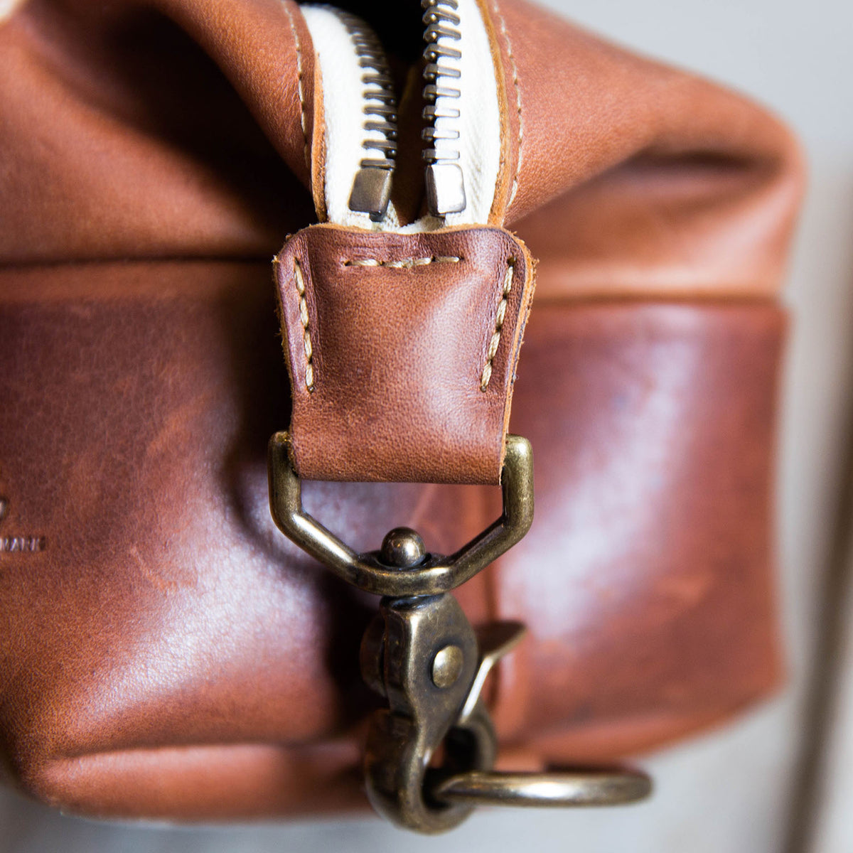 Dopp Bag - Personalized brown leather toiletry bag with zipper, perfect for travel and grooming essentials.