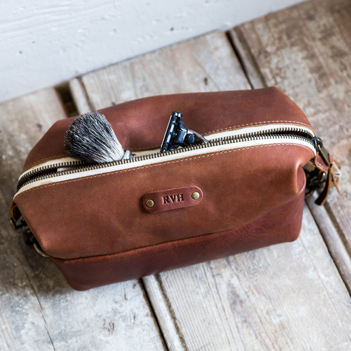 Dopp Bag - Personalized brown leather toiletry bag with zipper, perfect for travel and grooming essentials.