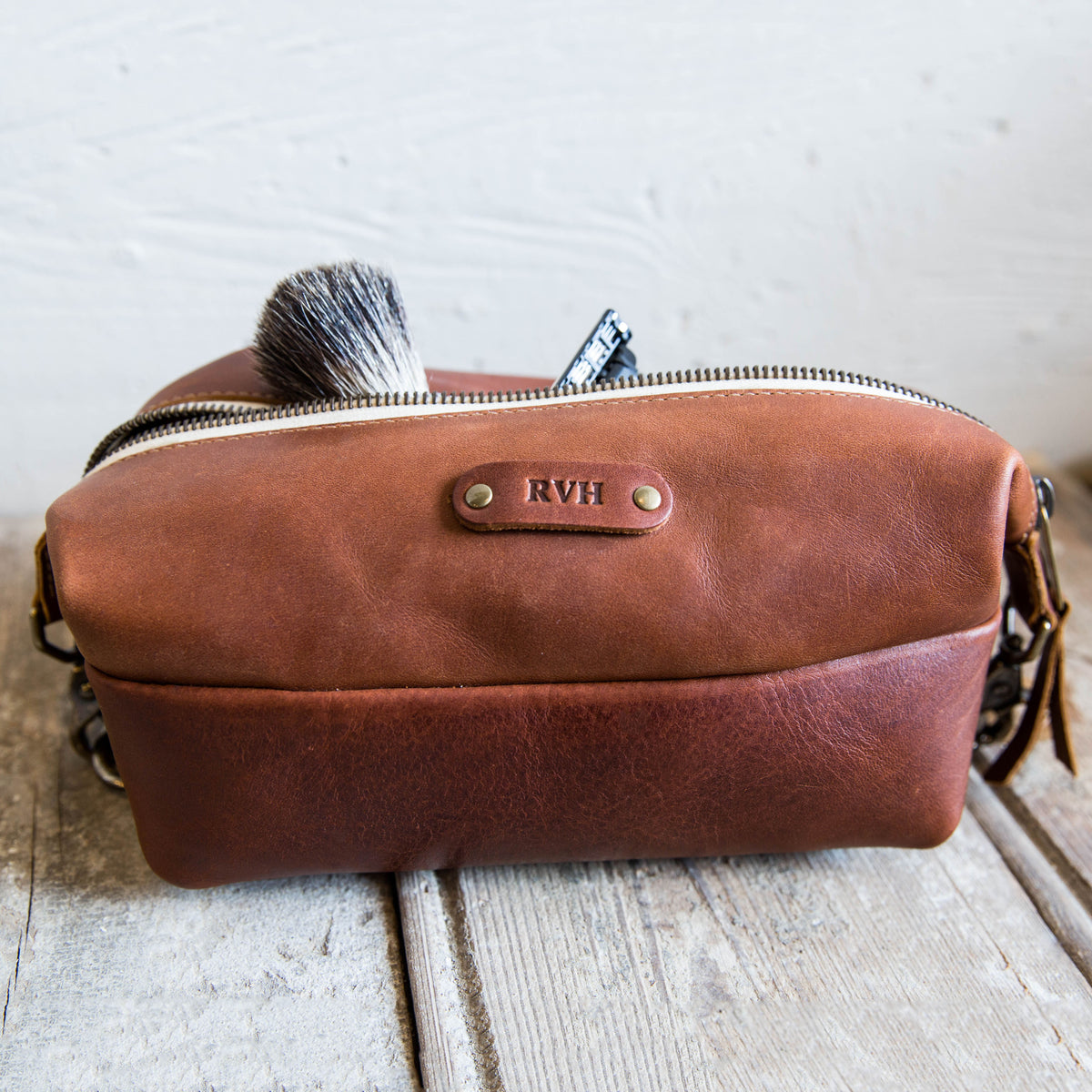 Dopp Bag - Personalized brown leather toiletry bag with zipper, ideal for travel and grooming essentials.