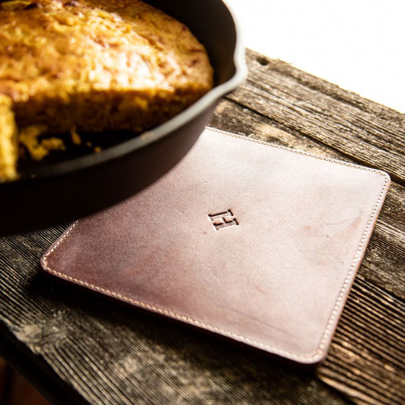 Leather trivet in natural color, perfect for protecting surfaces from hot pots and pans. American made quality.
