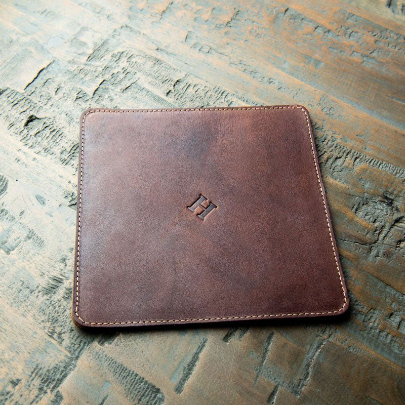 Leather trivet in brown, American made, perfect for protecting surfaces from hot pots.