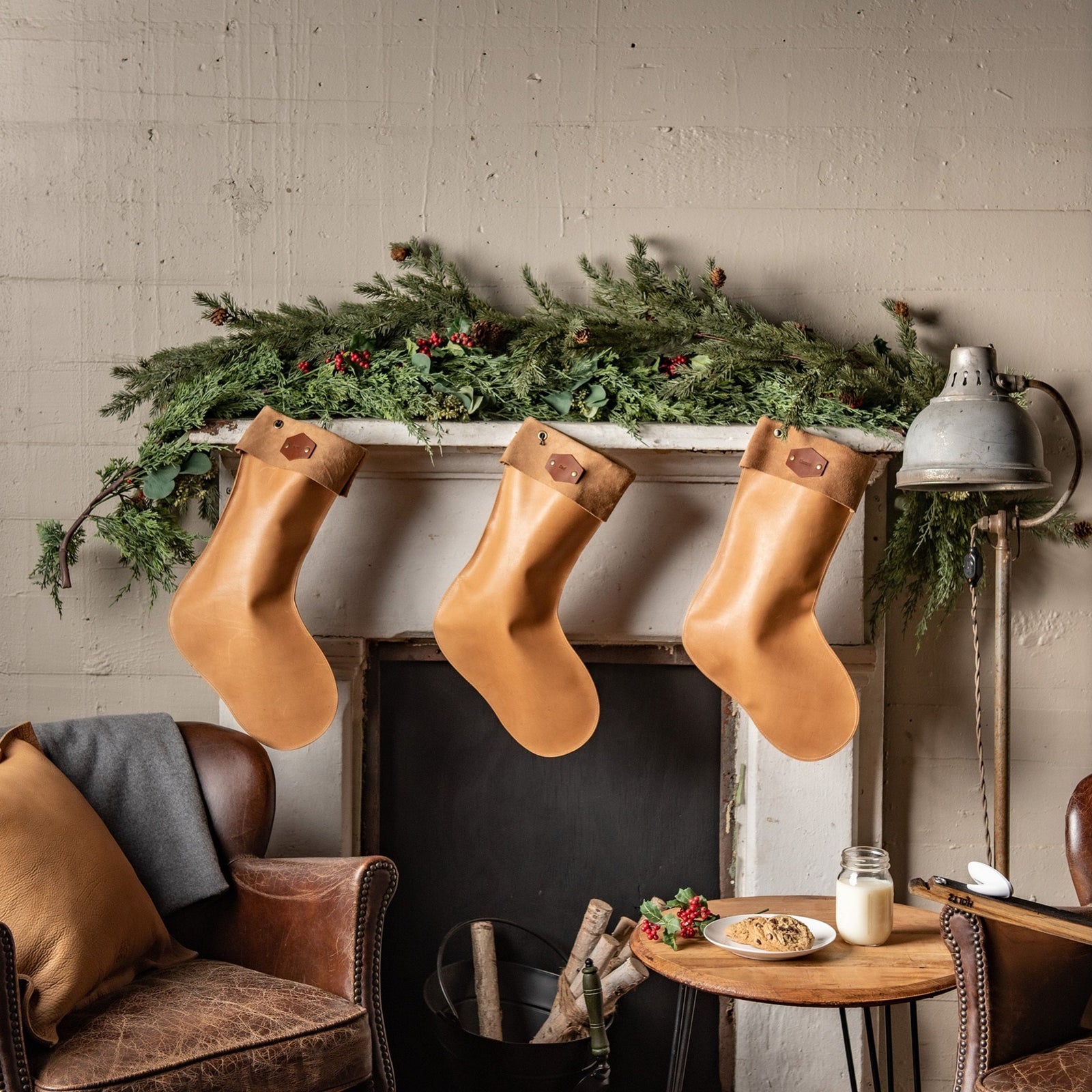 Hand-crafted leather stocking in brown and tan, made from premium quality leather for durability. Designed to enhance holiday decor and create lasting family memories.